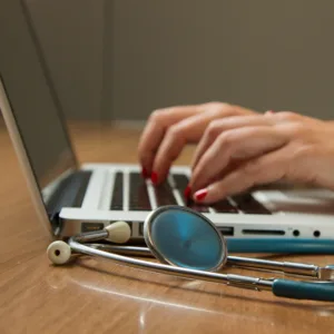 Up Close Photograph of a doctor using a laptop